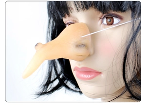 Close-up of a long flesh-colored witch nose with realistic textures for Halloween costumes