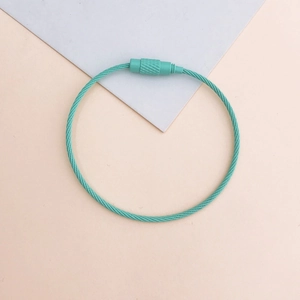 Detail of mint green wire keychain cable ring with a secure screw locking mechanism