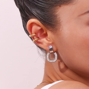 Women's 18K gold C-shape ear cuff and silver horseshoe zircon earring set on model