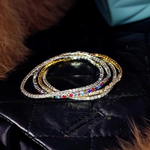 Macro shot of 2.0mm rhinestone tennis bracelets in silver, gold, and colorful finishes