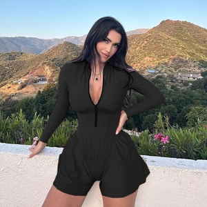 Close-up of black long sleeve playsuit with front zipper and cinched waist detailing