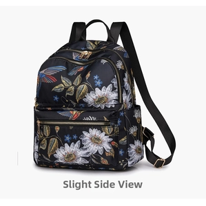 Slight side view of a black floral backpack featuring colorful hummingbirds and daisies