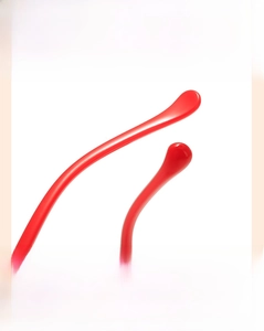 Detail of red curved temples with ergonomic non-slip design for kids glasses