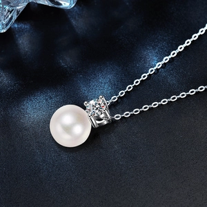S925 sterling silver necklace with a lustrous white pearl and sparkling moissanite pendant