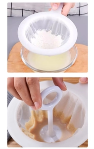 Macro shot of fine mesh soybean milk filter with press rod and white plastic handle