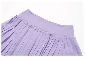 Detailed close-up of pleated lavender tennis skirt featuring a smooth elastic waistband