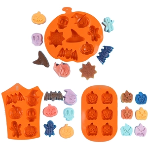 Set of 3 orange silicone Halloween baking molds with pumpkin, skull, and bat shapes