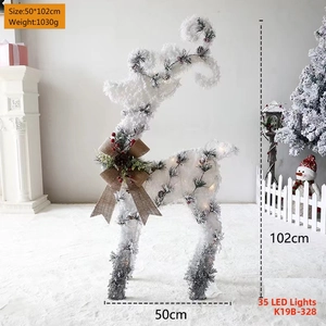 Glittery white reindeer Christmas decoration with pine cone detail and 35 LED lights