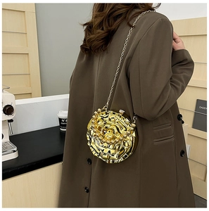 Chic gold 3D rose-shaped jelly bag with chain strap styled with a brown winter coat