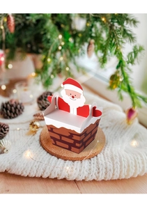 3D Santa climbing chimney gift box on cork coaster with cozy Christmas background decor