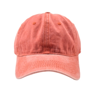 Detail of coral red washed cotton baseball cap showing vintage texture and stitching