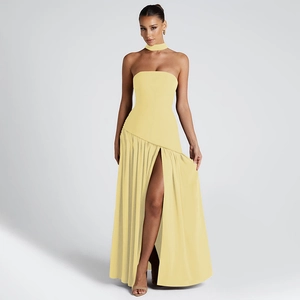 Detailed view of yellow strapless evening dress with side slit and elegant neck scarf