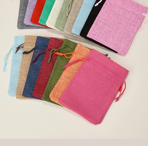 Linen drawstring bags in various colors showing fabric texture and cord closure details