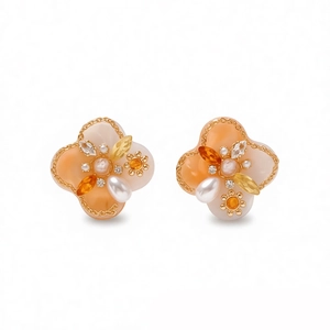 Vintage palace style pearl flower earrings with gold trim and clover shaped resin petals