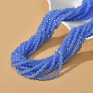 Macro view of 4mm faceted blue opal glass spacer beads for DIY jewelry making