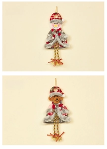 Detailed view of plush Christmas ornaments featuring snowman, bear and golden bells