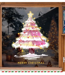 Pink Christmas tree window sticker with Merry Christmas text on a glass door