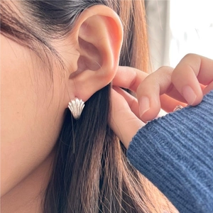 Minimalist 925 sterling silver shell earrings for women shown on model ear