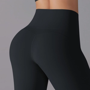 Close-up of high-waisted black yoga leggings with V-shaped stitching for a lifting effect