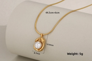 Macro shot of gold stainless steel necklace with pearl pendant and size measurements