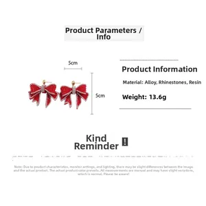 Detailed specs of red resin bow earrings with rhinestones size 5x5cm weighing 13.6g
