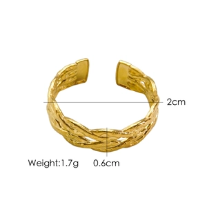 Macro shot of gold woven texture ring with dimensions 2cm inner diameter and 0.6cm width