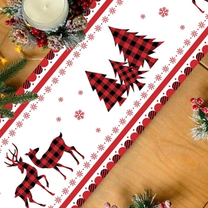 Christmas table runner with red buffalo plaid, reindeer, and pine tree on wooden table