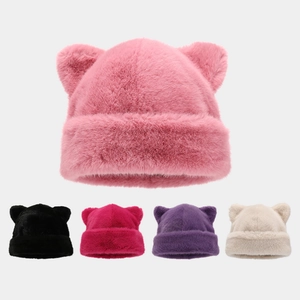 Detail of soft faux fur cat ear hats showing five various colors on a grey background
