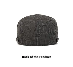 Detail view of the back of a dark grey vintage cotton flat cap with metal buckle closure