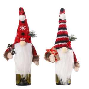 Christmas gnome wine bottle covers with red knitted hats and festive berry decor