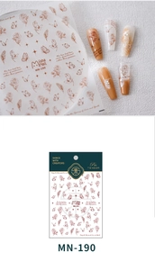 Detail of vintage rose and butterfly nail stickers with artistic cursive lettering