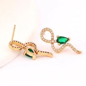 Elegant gold snake earrings with sparkling diamonds and a pear-cut green gemstone
