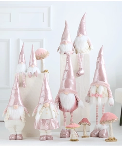 Pink Christmas gnomes set with plush textures and sequined hats on white display pedestals