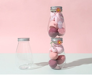 Storage jars for makeup sponges featuring decorative stickers and floral charms