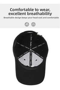 Internal detail of black cotton baseball cap showing 100% cotton label and stitching