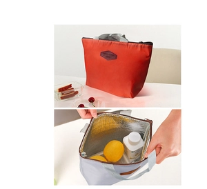 Detail view of insulated lunch bag showing the thermal aluminum foil lining and interior capacity