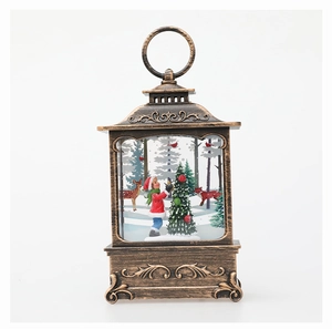 Detail of vintage bronze Christmas lantern with forest scene and hanging ring