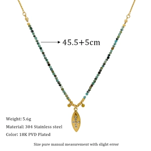 Detail of 18K gold plated stainless steel necklace with African turquoise beads and leaf charm