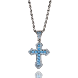 Close-up of hip hop silver rope chain with a large cross pendant set with blue zircons