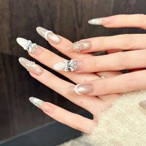 Champagne cat eye press-on nails with 3D pearls and rhinestones in long stiletto shape
