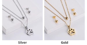 Dual-layer steel necklace and stud earrings set with hollow paw print pendant