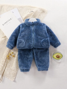 Navy blue fleece warm tracksuit for kids with zipper jacket and trousers on white background