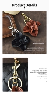 Detail of camellia leather flower keychains in black and brown with metal hooks