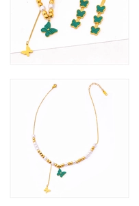 Detail of gold necklace with green butterfly pendant, white pearls and gold bead accents