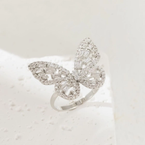 Macro shot of luminous butterfly ring featuring sparkling zircon stones and silver finish