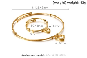 Detail of gold cable jewelry set with dimensions of heart pendants and twisted wire bangles