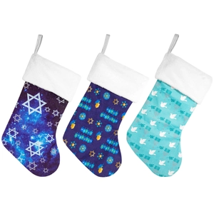 Three royal blue Hanukkah stockings with white plush cuffs and festive Star of David patterns
