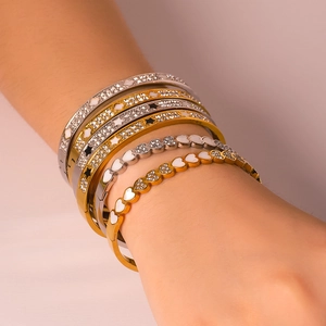 18K gold plated stainless steel bracelet set with diamonds and white enamel details