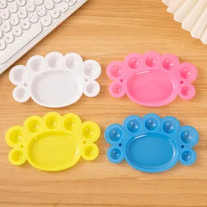 Cat paw shaped plastic paint palettes in four colors for watercolor and acrylic art