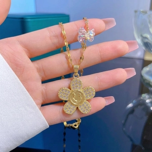Titanium steel gold flower necklace with crystal smiley pendant for women
